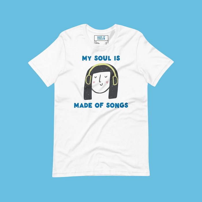 white t-shirt with cute illustrated face wearing headphones and blue words "my soul is made of songs"